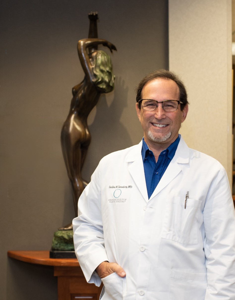Dr. Sheldon M Lincenberg stands in the hallway at his plastic surgery practice in Atlanta, Georgia